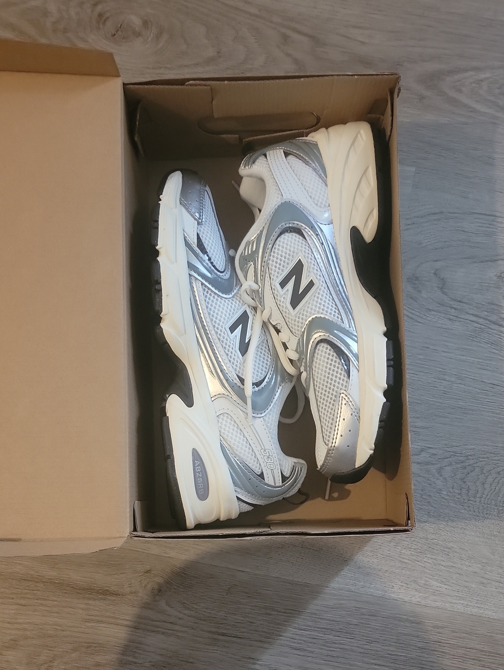 New Balance Kids White and Silver Athletic Sneakers
